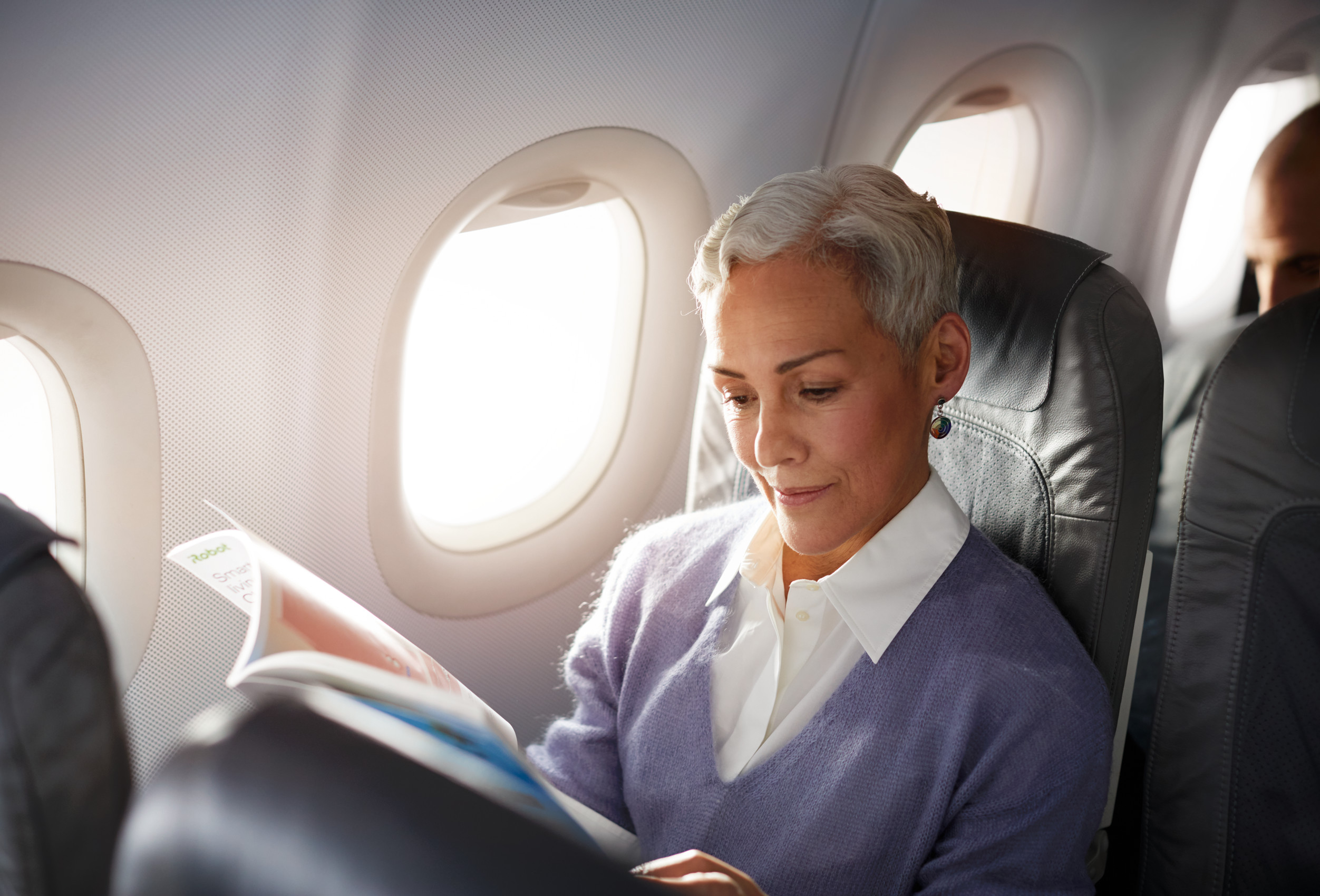 Female traveller reads magazine