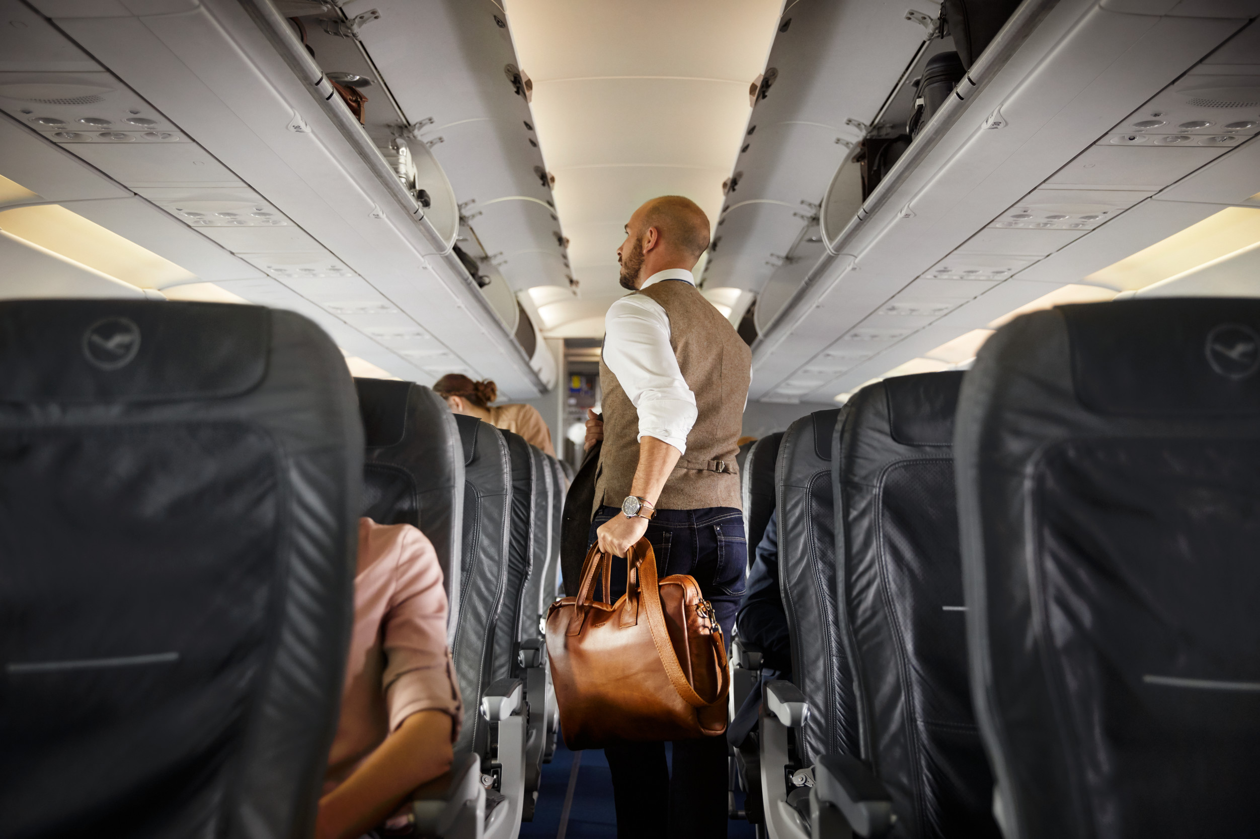 Traveller stores carry-on luggage