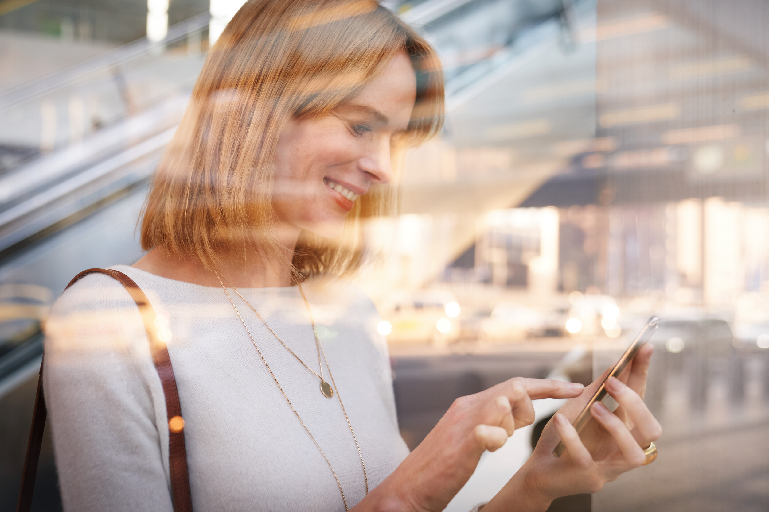 A person writes a message on their smartphone